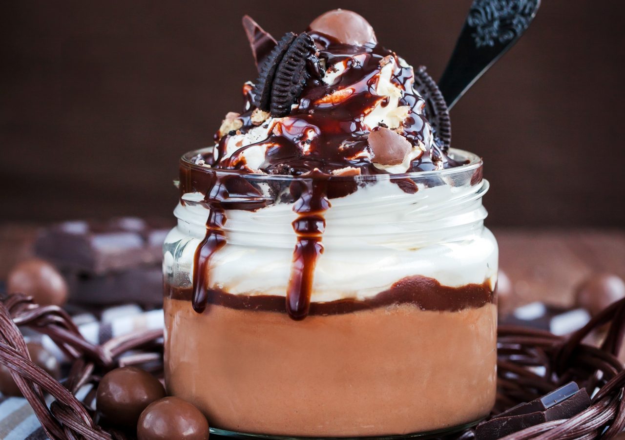 Chocolate mousse decorated with whipped cream